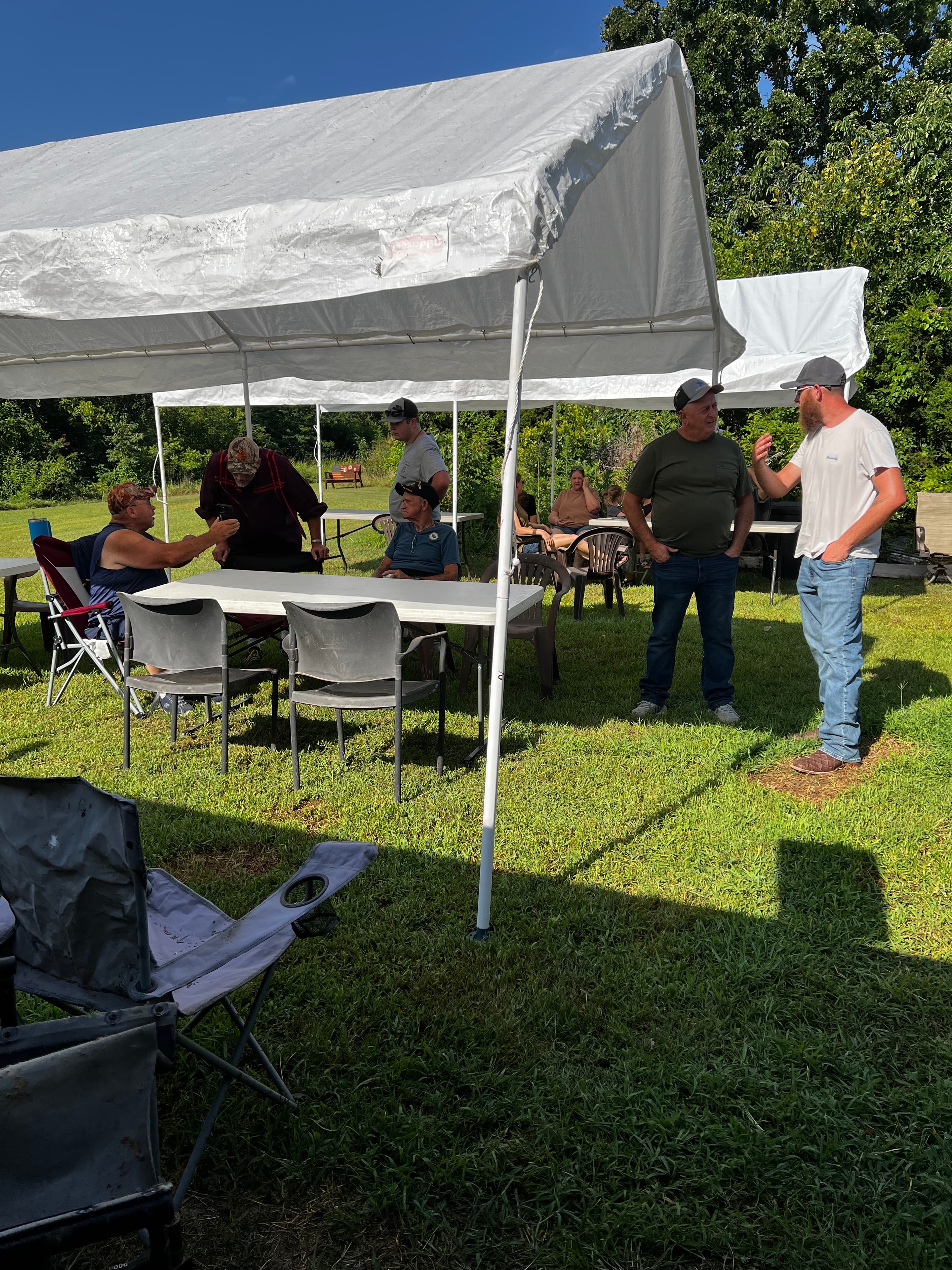 Tribal members gathering under a tent at Green Tree Ceremony July 11, 2026