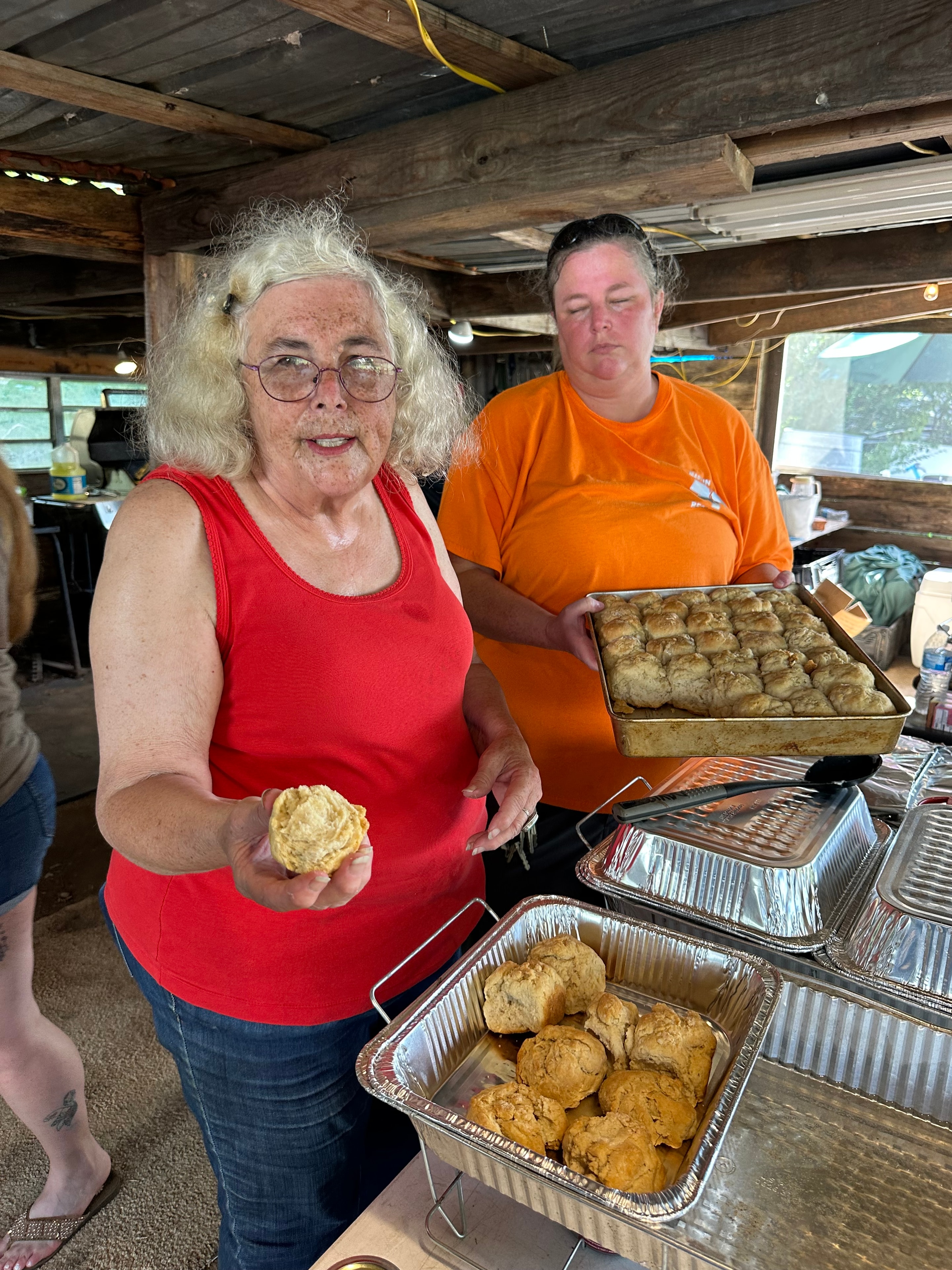 Tribal members serving traditional food at Green Tree Ceremony July 11, 2026