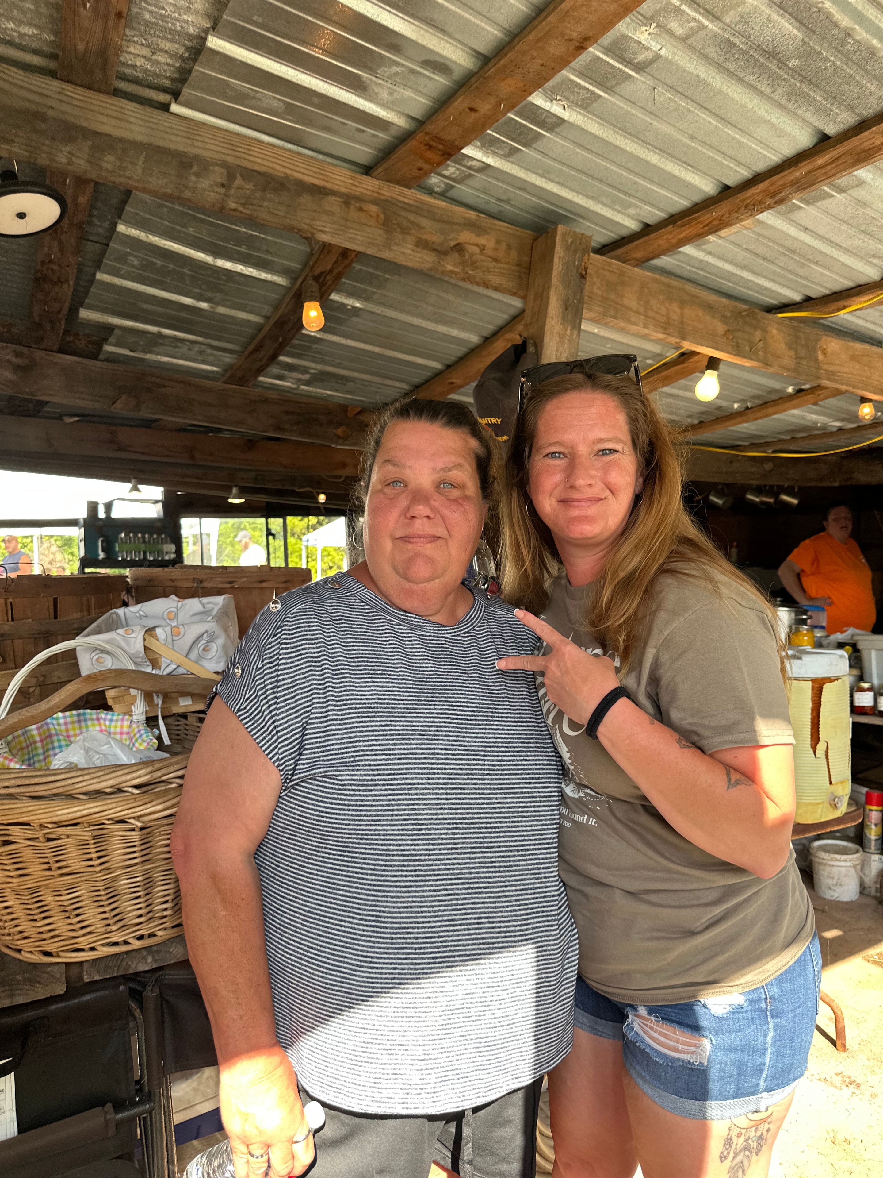 Two tribal members smiling together at Green Tree Ceremony July 11, 2026