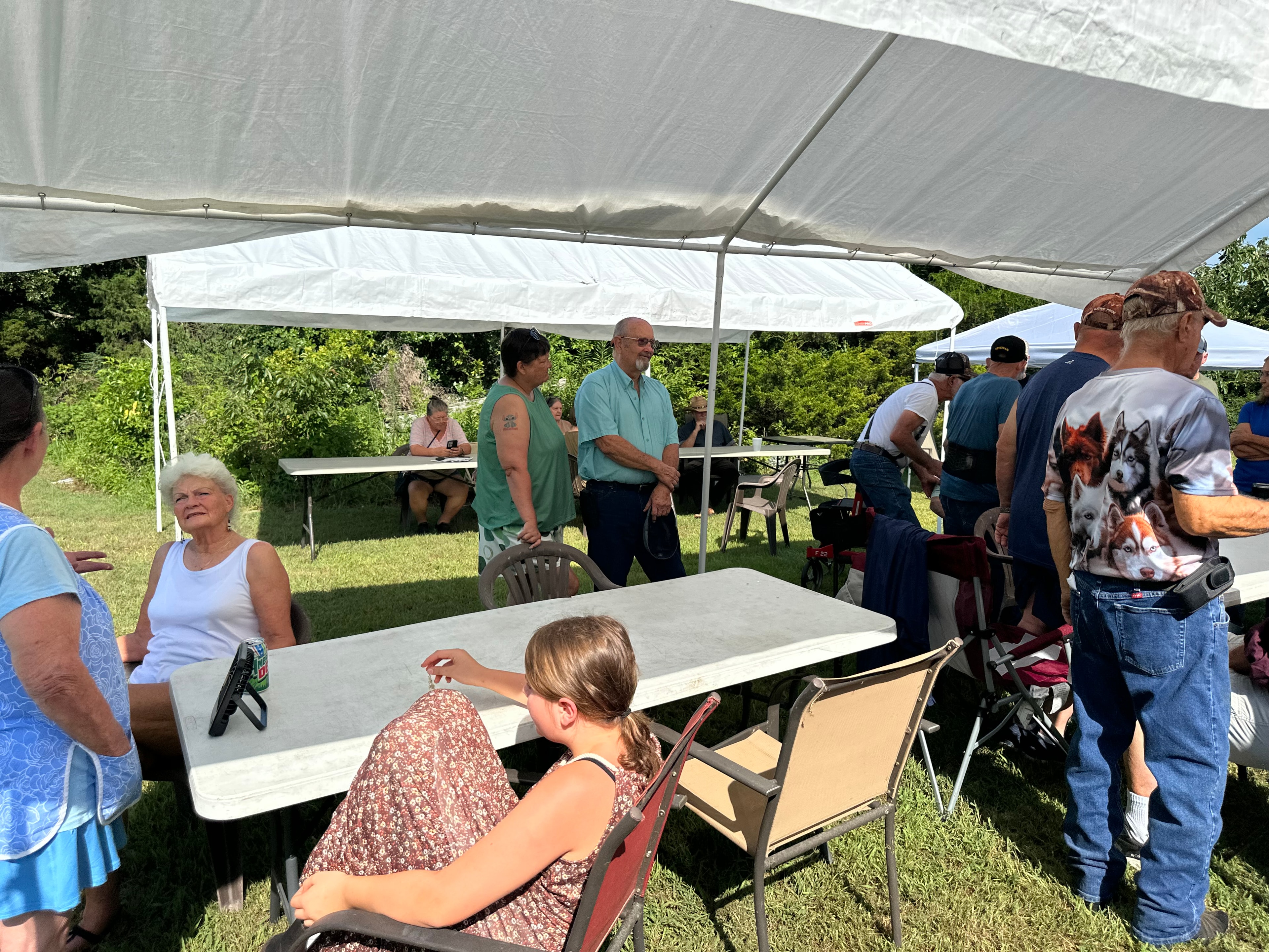 Large gathering of tribal members under the tent at Green Tree Ceremony July 11, 2026