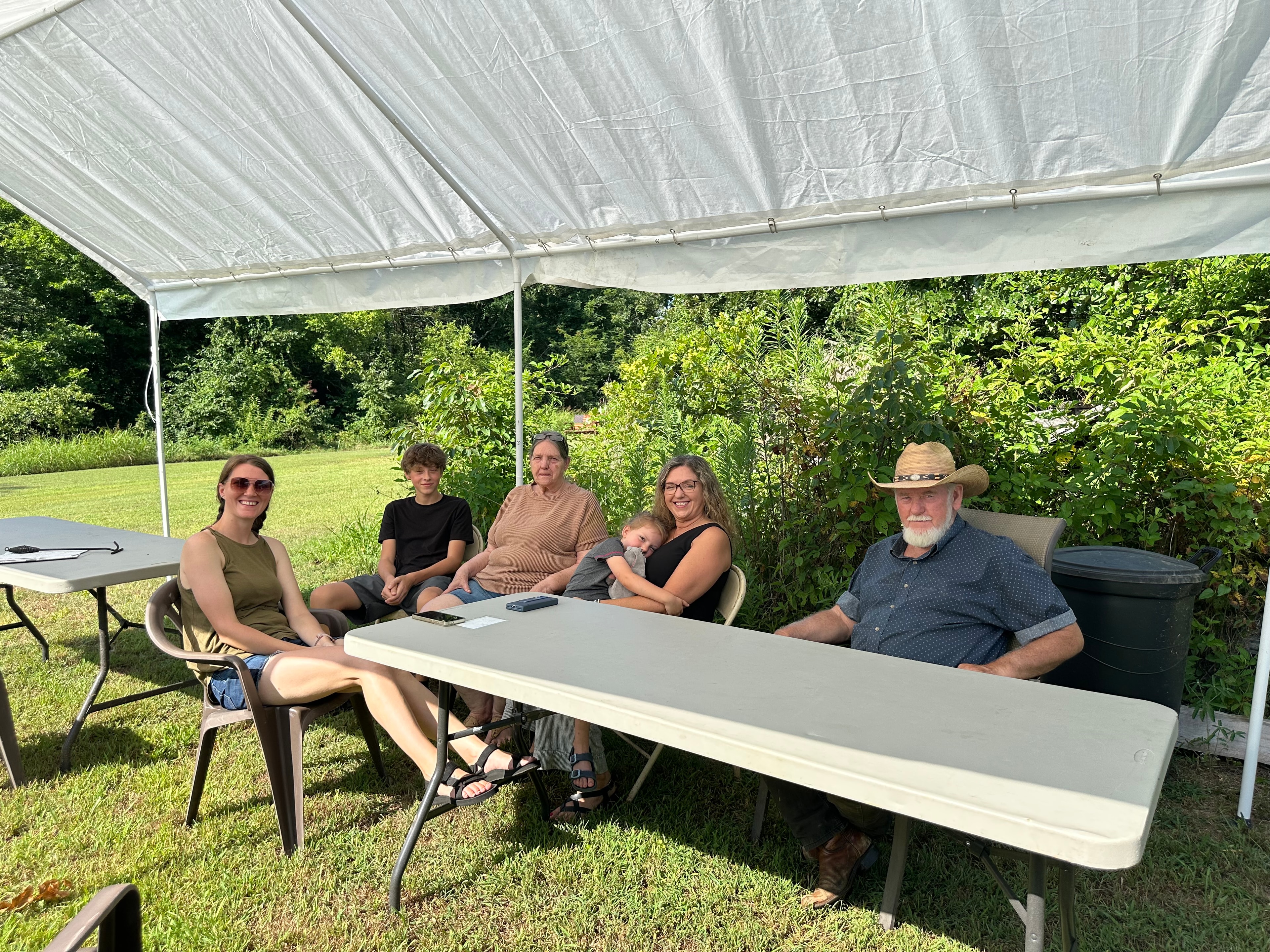 Family seated together at Green Tree Ceremony July 11, 2026