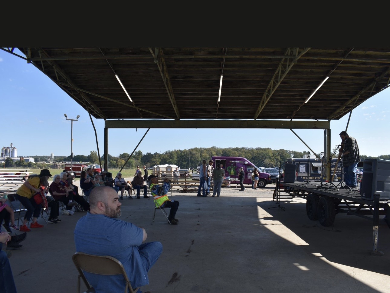 Crowd gathered under pavilion at Cherokee Chickamauga community event