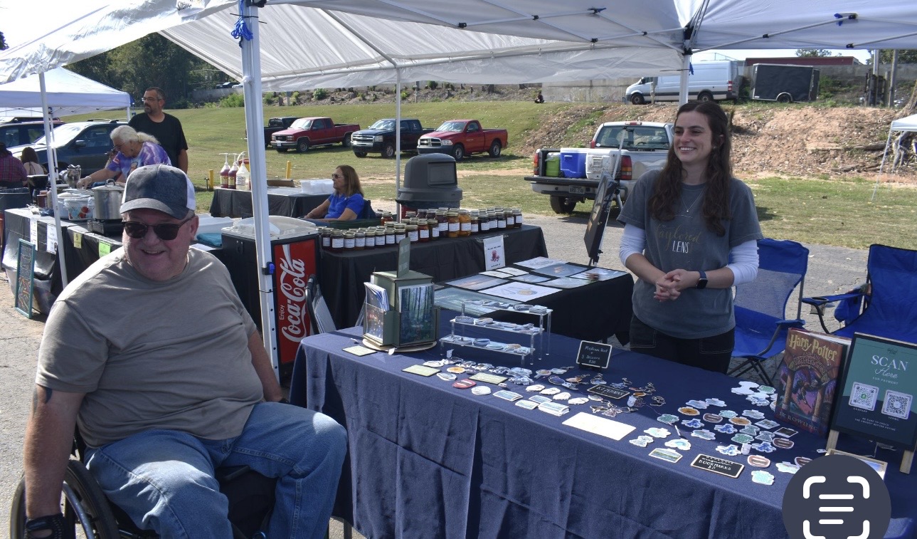 Vendor booth with tribal goods and jams at Cherokee Chickamauga gathering
