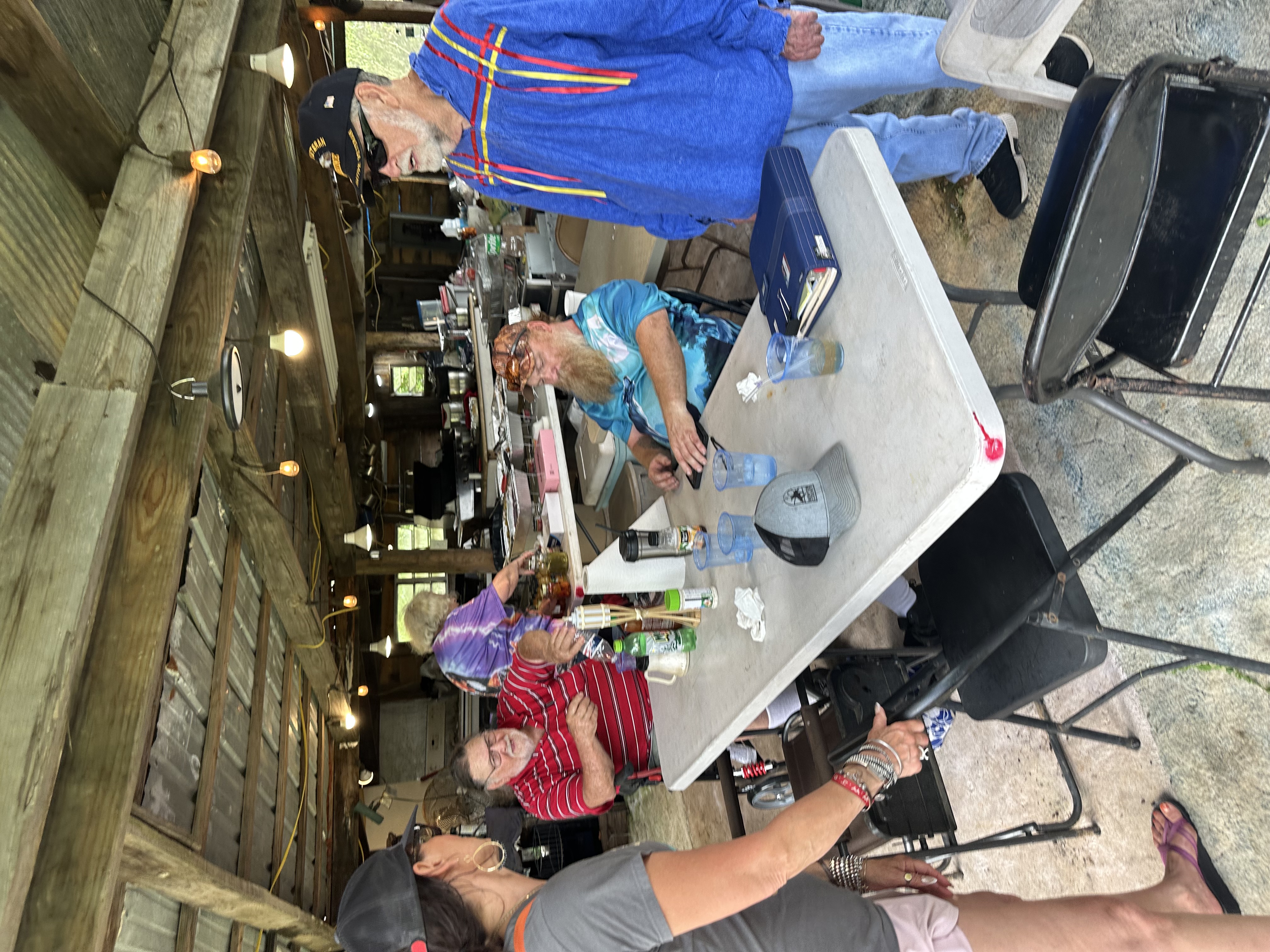 Tribal members gathered around the table at Green Corn Ceremony 2026