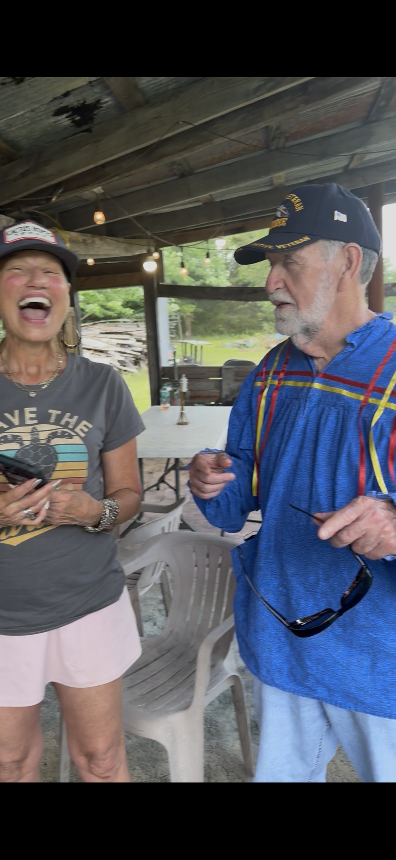 Tribal member and Native veteran sharing a laugh at Green Corn Ceremony 2026